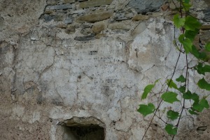 Writing still visible on the wall of the ruined synagogue in Dukla